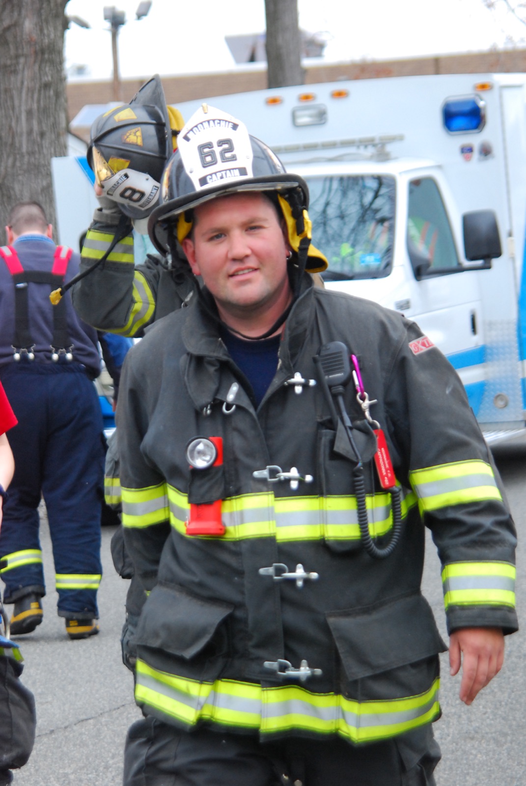 Lou serving as captain, carrying his helmet after a drill