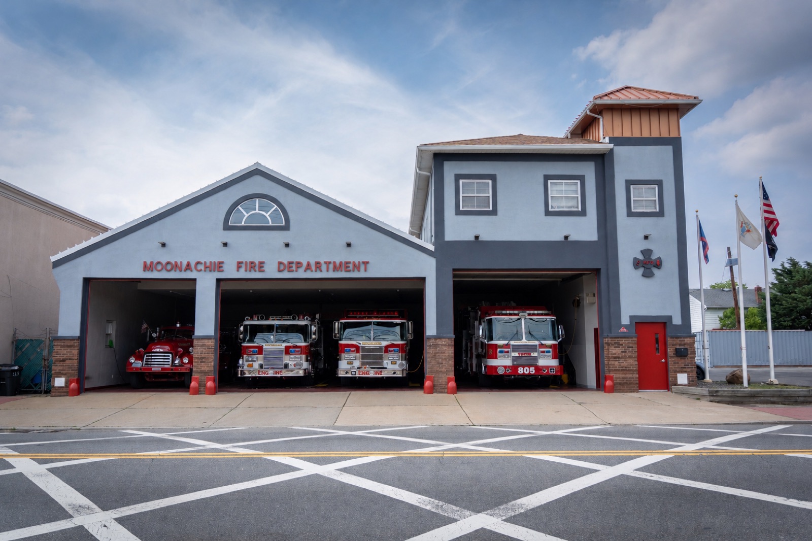 The Moonachie Fire Department firehouse with all bays open and the fleet on display