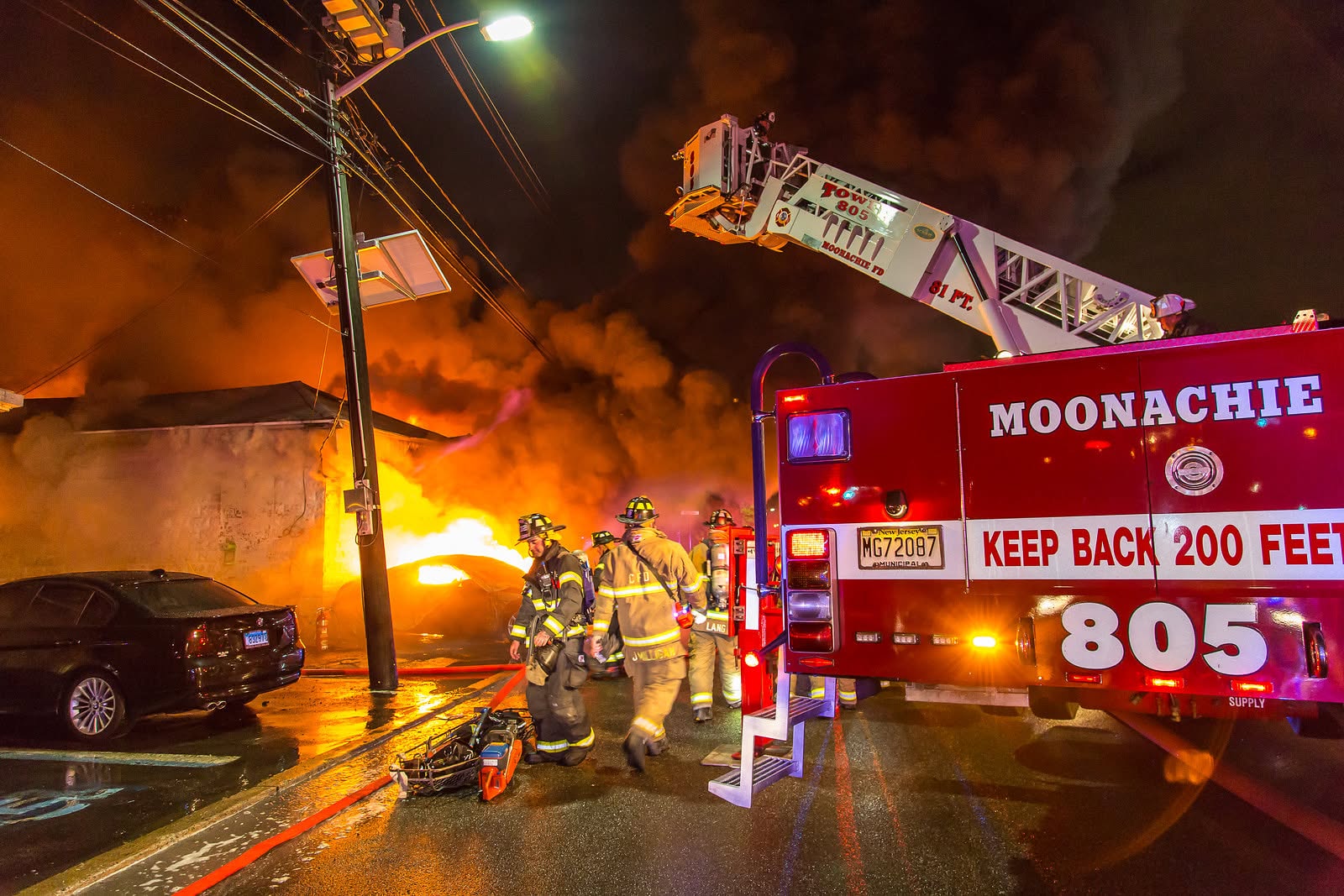 Moonachie Fire Department Tower 805 operating at a night structure fire